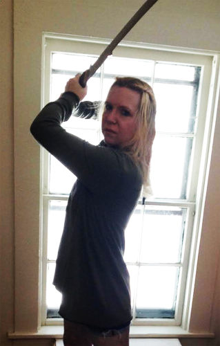 a photo of myself wielding hadhafang and wearing an army green waterfall cardigan