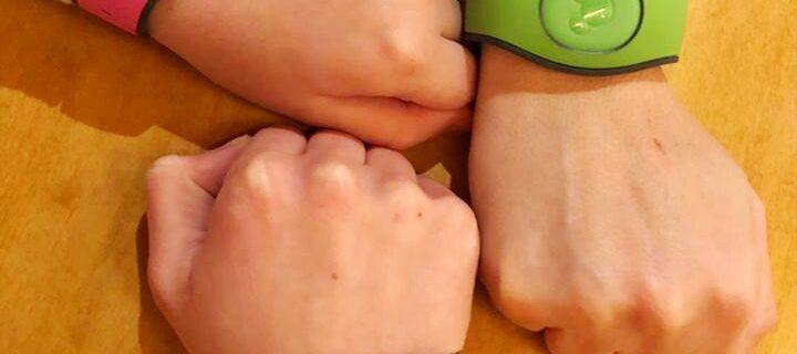 three magic bands on three wrists