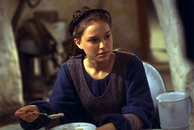 Padmé dressed in a simple blue and grey tunic on Tatooine